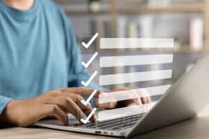 Man taking survey on laptop